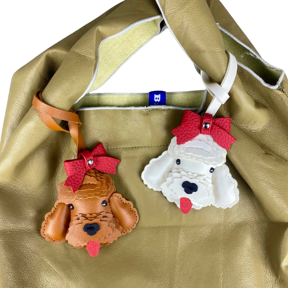 Handmade Leather Teddy Dog Bag Charm with Detachable Red Bow Tie – 3D Puppy Keychain for Bags